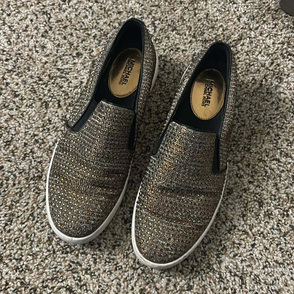 Used MK bronze sparkle slip ons.
